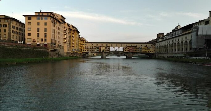 Ponte Vecchio in Florence Italy along the Arno River shot by drone, aerial cinematic video