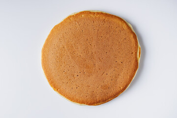 fresh tasty pancakes on a white background
