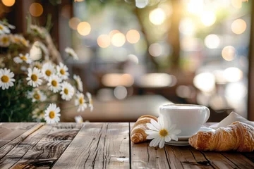 Fototapeten Coffee, croissants, and daisies set on a wooden table © Александр Раптовый