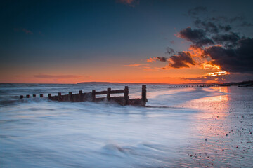 sunset on the beach long exposure camber sands east sussex clear evening summer red sky...