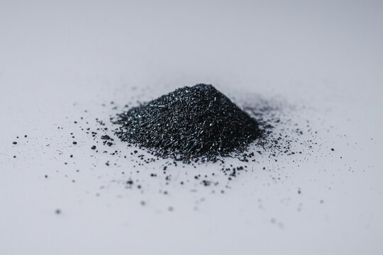 potassium permanganate crystals on a white background