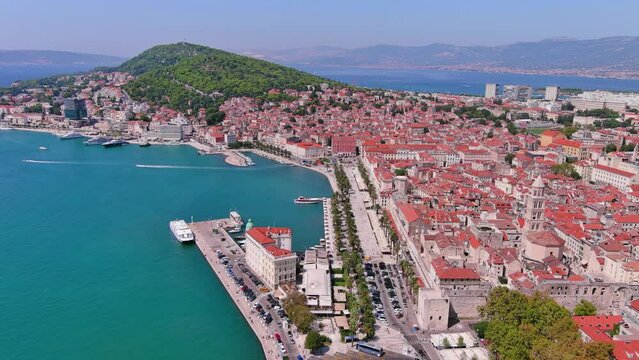Split, Croatia: Aerial view of famous Mediterranean city by Adriatic Sea, Diocletian's Palace and Saint Domnius Cathedral, summer day with clear blue sky - landscape panorama of Europe from above
