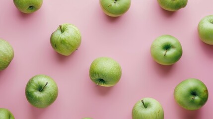 Vibrant Green Apples on Pink Background Flat Lay