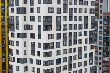 New apartment buildings with windows and balconies. Modern european complex of apartment buildings. And outdoor facilities. Mixed media