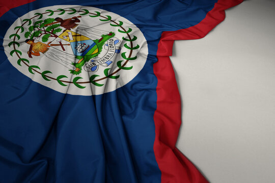 waving national flag of belize on a gray background.