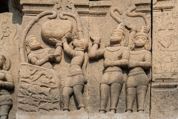 Fototapeta na wymiar Sculptures or carvings of Ramayana on the outer wall of Lord Vishnu temple. Located in the backwater of Ujjani Dam, Palasdev, Indapur, Maharashtra, India.