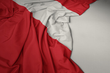 waving national flag of peru on a gray background.