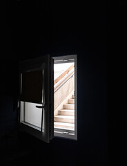 Concrete Steps Through A Bedroom Window In A Bleak Apartment Block