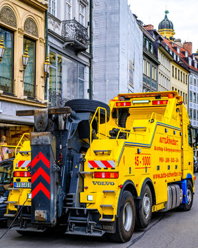 Munich, Germany - June 1: Typical German tow truck in the old town of Munich on June 1, 2022