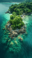 Vertical portrait-oriented aerial photo of a paradise island with crystal clear waters