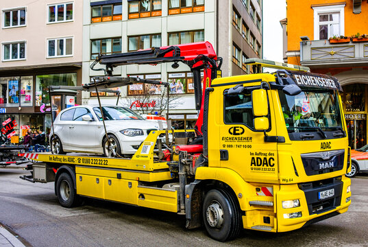 Munich, Germany - February 4: Typical German tow truck in the old town of Munich on february 4, 2024