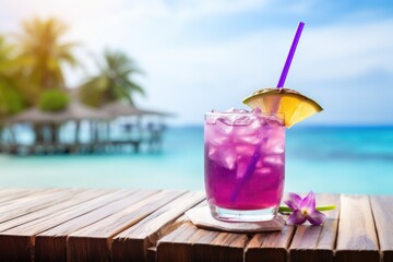 fresh purple cocktail on tropical beach in summer