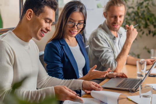 Startup business team in meeting at modern office. Businessman explaining new business ideas to colleagues. Team leader having business conversation about new projects startups