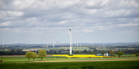Ense, NRW, Germany, 04 15 2024, wind par, several wind generators, Cooling towers of a power plant...