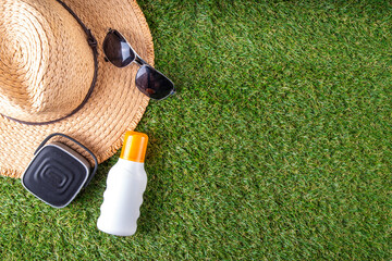 Spring, summer picnic, outdoor recreation background. A woman's straw hat, a picnic blanket or...