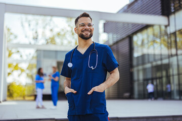 Portrait of a young medical practitioner standing with his arms crossed in a hospital. Happy in his...