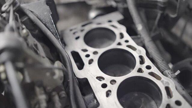 Car engine block cylinders with motion of pistons, camshaft, chain, valves and other mechanical parts, slow motion