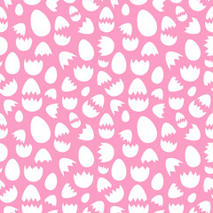 Cracked eggshells arranged on pink backdrop in seamless pattern. Attractive eggs and broken shells surface art for printing or use in graphic design projects.