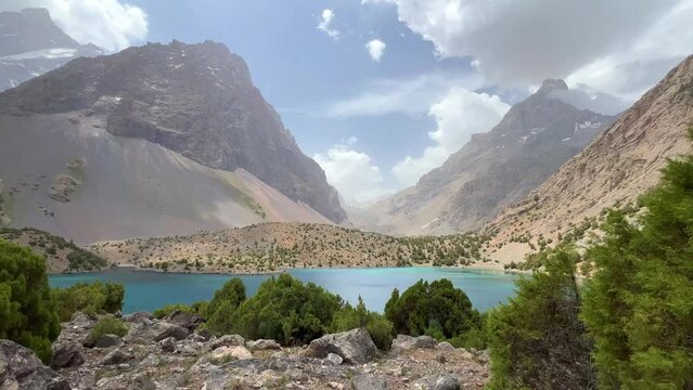 The Alaudin (Chapdara) lakes, lying at an altitude of 2800 m, are considered one of the most beautiful lakes of the Fan Mountains. Turquoise mountain lake. Pamiro-Alai. Tajikistan, Pamir 4K