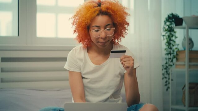 African American woman having problems with credit card payment, cancelation
