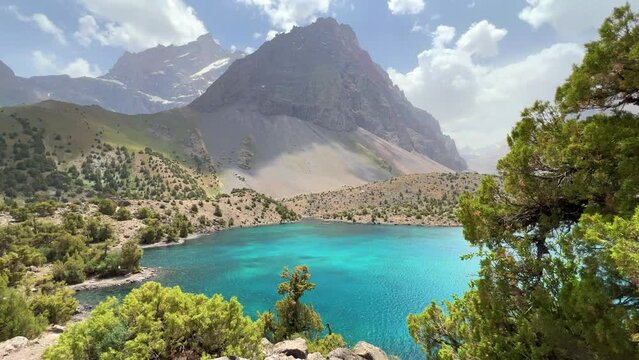 The Alaudin (Chapdara) lakes, lying at an altitude of 2800 m, are considered one of the most beautiful lakes of the Fan Mountains. Turquoise mountain lake. Pamiro-Alai. Tajikistan, Pamir 4K