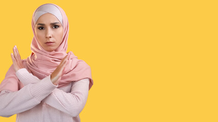 No gesture. Enough warning. Female protest. Confident serious dissatisfied woman in headscarf...