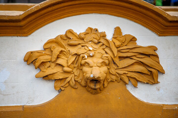 Lion ornament on old building facade