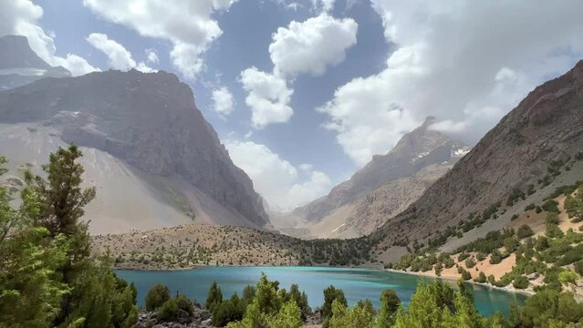 The Alaudin (Chapdara) lakes, lying at an altitude of 2800 m, are considered one of the most beautiful lakes of the Fan Mountains. Turquoise mountain lake. Pamiro-Alai. Tajikistan, Pamir 4K