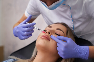 Woman having beauty procedure in beauty salon - 787188864