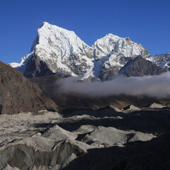 Ngozumba Glacier and high mountains Cholatse and Tobuche, Nepal.