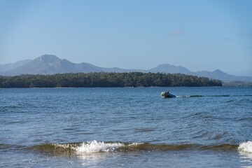 tinny dinghy boat on a river in a national park in the australian bush, On the beach in summer