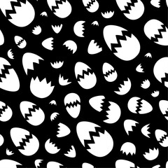 Differently sized cracked eggshells placed incoherently against a black background. Dynamic black and white vector seamless pattern for printing on different materials or use in graphic design project