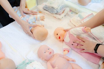 New mothers receive training from experts on swaddling their newborns through classes.