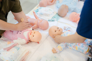 New mothers receive training from experts in swaddling their newborns.