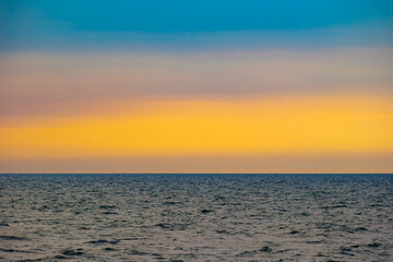 skyline view The sun sets in the evening sky with colorful clouds. and beautiful cloud patterns In the soft light Evening at the sea	
