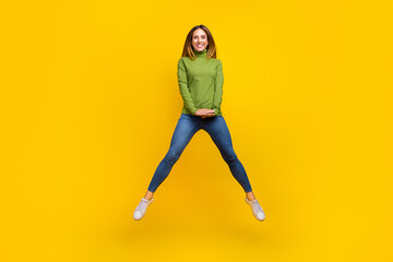 Full body portrait of satisfied glad lady enjoy free time jump toothy smile isolated on yellow...