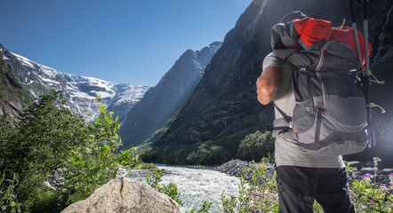 Man Exploring Norwegian Vestland Glaciers with a Backpack