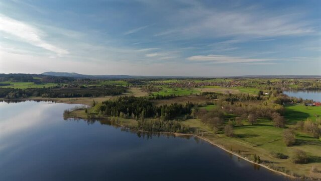 Aerial view, Staffelsee with islands, Garmisch Partenkirchen region, Bavaria, Germany near Murnau in sunny weather at sunset in spring. Drone view over islands of a large beautiful lake in Bayern. 
