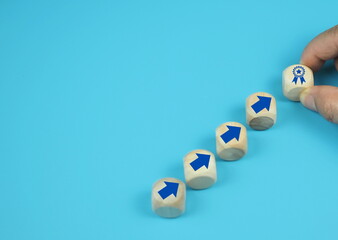 hand putting virtual quality assurance and up arrow which print screen on wooden cube for quality enhancement of guarantee product and ISO service concept.