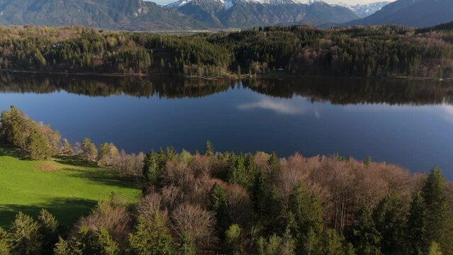 Aerial view, Staffelsee with islands, Garmisch Partenkirchen region, Bavaria, Germany near Murnau in sunny weather at sunset in spring. Drone view over islands of a large beautiful lake in Bayern. 