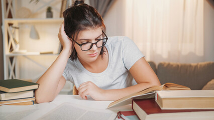 Study fatigue. Overworked student. Education stress. Tired sleepy woman reading book preparing for hard exam home interior. - 787207617