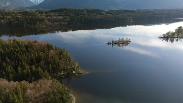 Aerial view, Staffelsee with islands, Garmisch Partenkirchen region, Bavaria, Germany near Murnau in sunny weather at sunset in spring. Drone view over islands of a large beautiful lake in Bayern. 