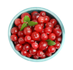 Bowl of fresh ripe cranberries with leaves isolated on white, top view