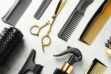 Hairdressing tools on light background, flat lay