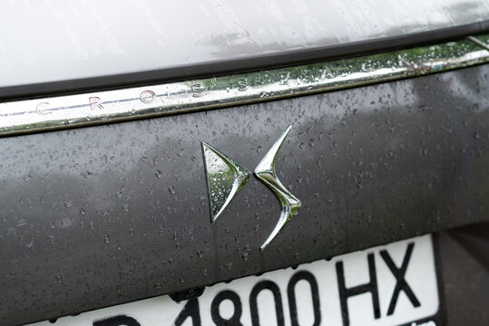 Kyiv, Ukraine - April, 2024. Ds 7 Crossback exterior car close-up logo with water drops 