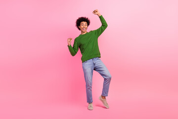 Photo of happy cheerful guy standing raise fists up winning isolated pastel color background