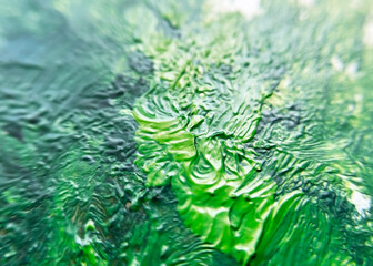 green brush strokes on canvas close up