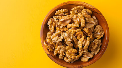 Walnut kernel halves in a wooden bowl Closeup from above on colored background Healthy eating Walnut concept Super foods with copy space : Generative AI