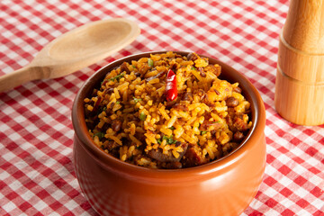 Baião de Dois traditional Brazilian food with rice, beans, sausage and rennet cheese front view