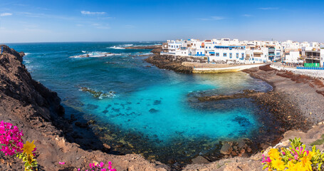 Panoramic view of the fishing coastal town El Cotillo in the municipality of la Oliva and the blue natual lagoon in Fuerteventura -  Province of Las Palmas, Canary Islands, Spain